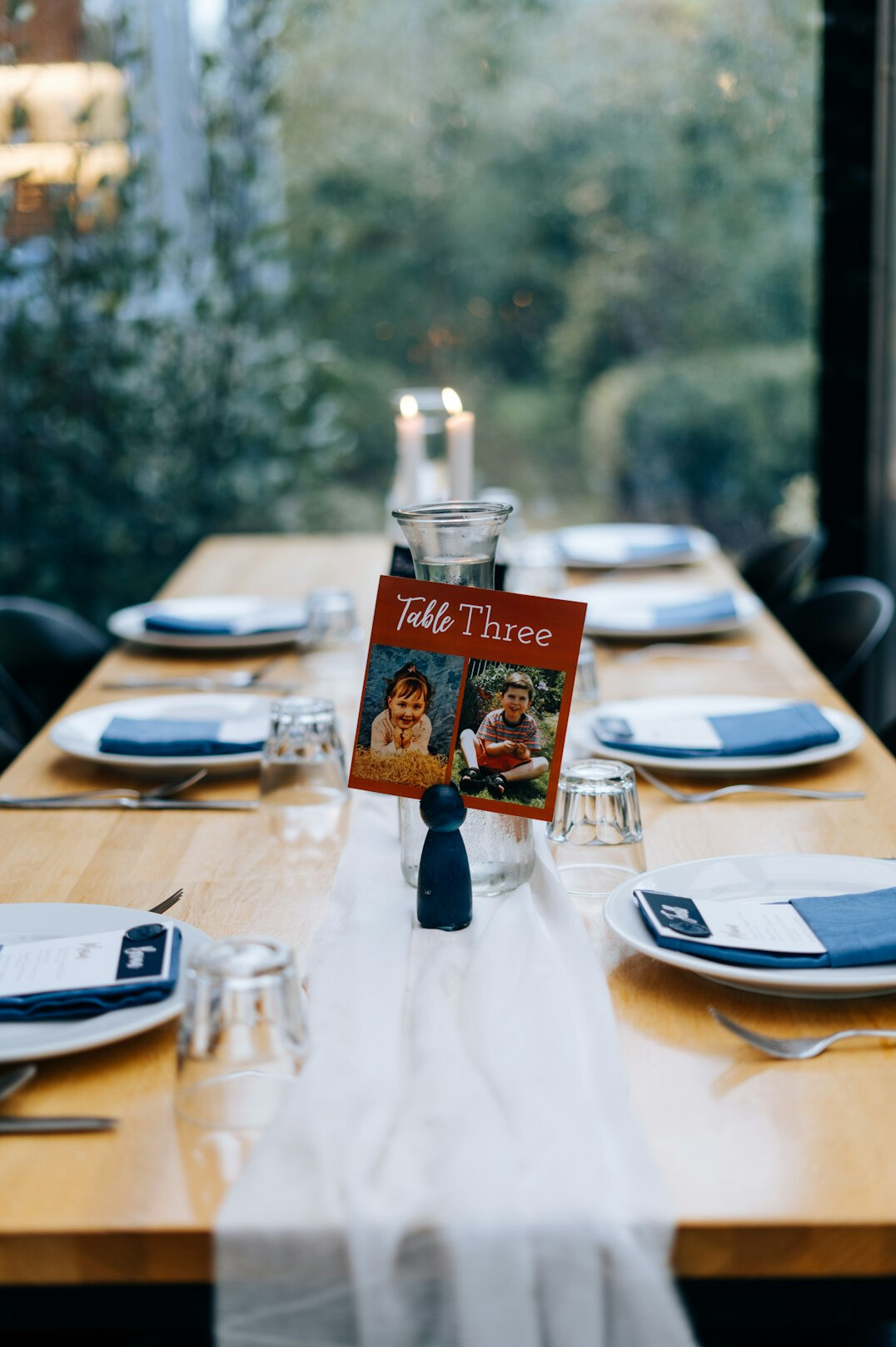 Open magazine pages with celebrity photos on a wooden table