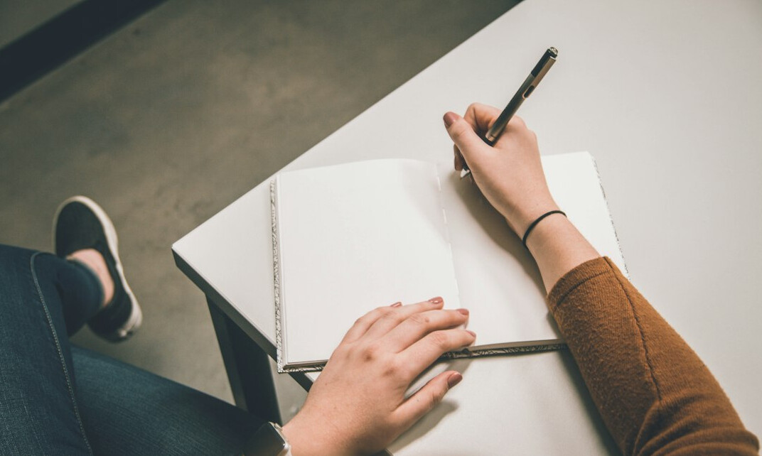 person writing notes