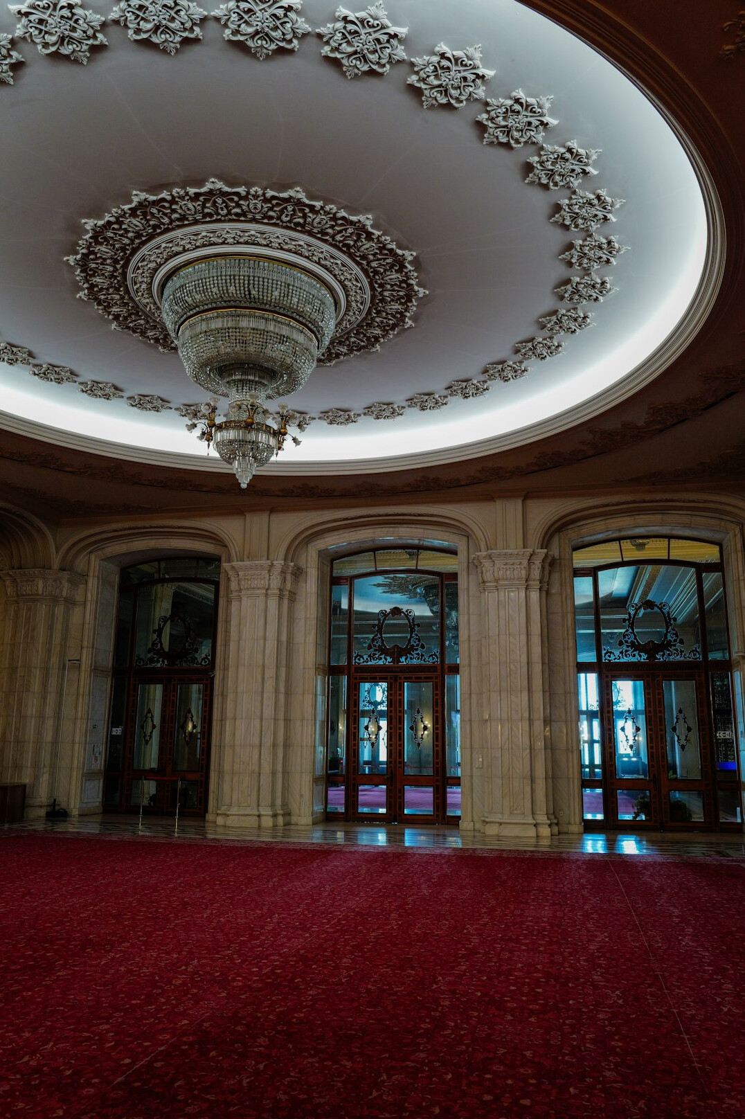 Red carpet entrance with photographers and bright lights