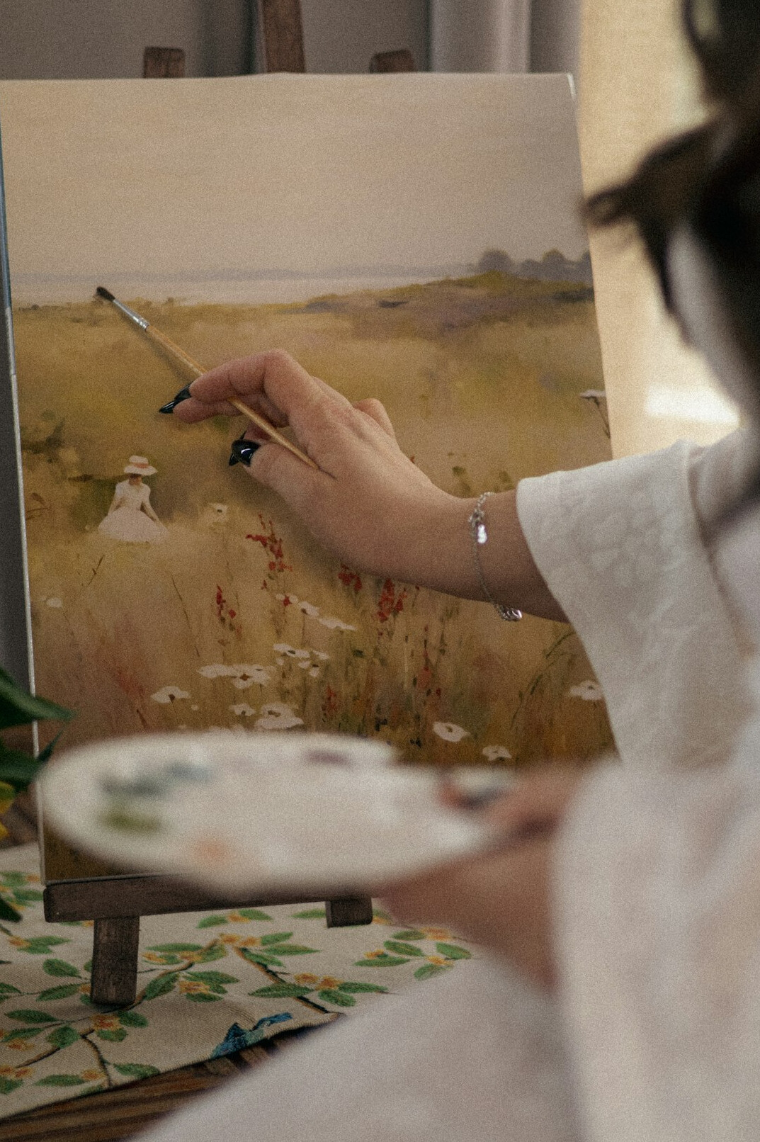 woman painting landscape
