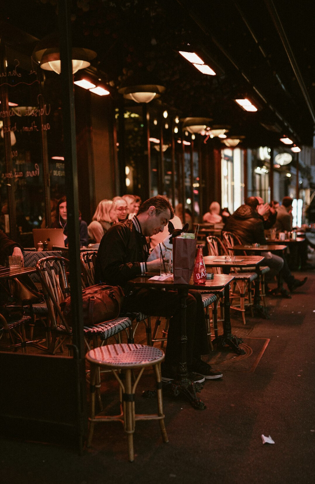 Person reading exclusive celebrity news on a tablet in a cafe